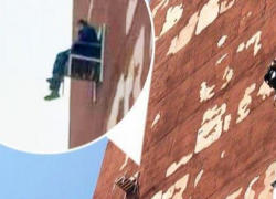 В Кишинёве сняли мужчину, который повесил кресло на отвесную стену многоэтажного дома и отдыхал в нём